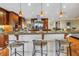 Gourmet kitchen features a large island with bar seating, custom cabinets, and stainless steel appliances at 351 S Julia Cir, St Pete Beach, FL 33706