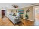 Bright and airy living room featuring tile flooring and comfortable contemporary furnishings at 351 S Julia Cir, St Pete Beach, FL 33706