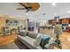 Open-concept layout showcasing the living room, bar area, and kitchen with dark wood cabinets at 351 S Julia Cir, St Pete Beach, FL 33706