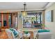 Cozy living room with views of the water and a covered patio with comfortable seating at 351 S Julia Cir, St Pete Beach, FL 33706