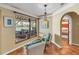 Bright sitting room with tile floors and a view of the water at 351 S Julia Cir, St Pete Beach, FL 33706