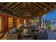Stunning waterfront covered patio with cozy seating, perfect for enjoying serene views and outdoor relaxation at 351 S Julia Cir, St Pete Beach, FL 33706