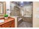 Modern shower with glass enclosure, built-in bench, and elegant fixtures at 351 S Julia Cir, St Pete Beach, FL 33706