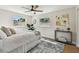 Cozy bedroom with a ceiling fan, windows providing natural light, and stylish decor at 3540 Emerson S Ave, St Petersburg, FL 33711