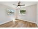 Bright, empty bedroom offers hardwood floors, neutral walls and large windows allowing ample light at 3540 Emerson S Ave, St Petersburg, FL 33711