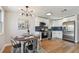 Modern kitchen with stainless steel appliances, white cabinetry, and blue subway tile backsplash at 3540 Emerson S Ave, St Petersburg, FL 33711