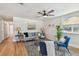 Bright living room features modern decor, a ceiling fan, and warm-toned wood flooring at 3540 Emerson S Ave, St Petersburg, FL 33711