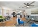 Open-concept living and dining area with modern lighting and stainless steel appliances at 3540 Emerson S Ave, St Petersburg, FL 33711