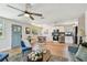 Bright living room leads to the dining and kitchen area with stainless steel appliances at 3540 Emerson S Ave, St Petersburg, FL 33711