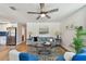 This bright living room features modern decor and flows into the adjacent kitchen at 3540 Emerson S Ave, St Petersburg, FL 33711