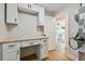 Home office space features built-in desk, ample storage, and doorway leading to the bedroom at 3540 Emerson S Ave, St Petersburg, FL 33711