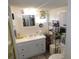 Bright bathroom with updated vanity, mirror, and fixtures plus ample storage at 36624 Kay Ave, Zephyrhills, FL 33542