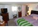 Spacious bedroom with dresser storage and a small window and desk at 36624 Kay Ave, Zephyrhills, FL 33542