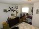 Inviting bedroom with stylish decor, shelving and a dedicated music practice area at 36624 Kay Ave, Zephyrhills, FL 33542