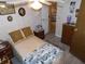 Well-lit bedroom featuring decoratively wallpapered walls and a warm, cozy atmosphere at 36624 Kay Ave, Zephyrhills, FL 33542