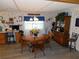 Cozy dining area with a wood table, seating for four, and a decorative hutch at 36624 Kay Ave, Zephyrhills, FL 33542