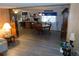 Open-concept dining area featuring a round table with chairs and a view into the kitchen at 36624 Kay Ave, Zephyrhills, FL 33542