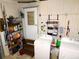 Functional laundry area with shelving and appliances for household needs at 36624 Kay Ave, Zephyrhills, FL 33542
