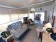 Sunroom featuring a ceiling fan and access to the carport at 36624 Kay Ave, Zephyrhills, FL 33542