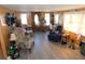 Cozy living room featuring ample seating and natural light from multiple windows at 36624 Kay Ave, Zephyrhills, FL 33542