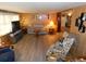 Cozy living room featuring comfortable seating and a light woodgrain plank floor at 36624 Kay Ave, Zephyrhills, FL 33542