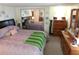 An ample main bedroom with closet and dresser storage and neutral decor at 36624 Kay Ave, Zephyrhills, FL 33542