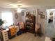 Bright home office with desk, shelving, and comfortable seating area at 36624 Kay Ave, Zephyrhills, FL 33542