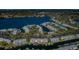 Aerial of a waterfront community with docks and lush greenery, offering serene residential living by the water at 5196 Beach Se Dr # B, St Petersburg, FL 33705