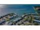 Aerial view of waterfront condo complex with lush landscaping, private boat slips, and ocean access at 5196 Beach Se Dr # B, St Petersburg, FL 33705