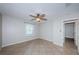 Bedroom featuring tile flooring, a ceiling fan, and a window with natural light at 5196 Beach Se Dr # B, St Petersburg, FL 33705