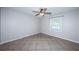 Comfortable bedroom with tile flooring, a ceiling fan, and a bright window at 5196 Beach Se Dr # B, St Petersburg, FL 33705