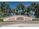 Waterside community sign framed by palm trees and colorful flowers, welcoming residents and guests at 5196 Beach Se Dr # B, St Petersburg, FL 33705