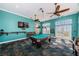 Inviting game room with a billiard table, TV, and comfortable seating, perfect for community entertainment at 5196 Beach Se Dr # B, St Petersburg, FL 33705
