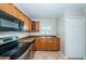 Cozy kitchen showcasing stainless steel appliances and well-lit granite countertops at 5196 Beach Se Dr # B, St Petersburg, FL 33705