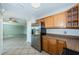 Bright kitchen featuring stainless steel refrigerator and tile flooring into the living room at 5196 Beach Se Dr # B, St Petersburg, FL 33705