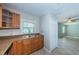 Kitchen with stainless steel dishwasher and sink plus wooden cabinetry at 5196 Beach Se Dr # B, St Petersburg, FL 33705