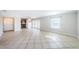 Open-concept living area with tile floors and access to the kitchen and patio at 5196 Beach Se Dr # B, St Petersburg, FL 33705