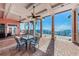 Covered outdoor patio with comfortable seating and scenic waterfront views with access to a private pier at 5196 Beach Se Dr # B, St Petersburg, FL 33705