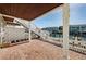 Covered patio features brick flooring, waterfront views, and stairs to upper floors at 5196 Beach Se Dr # B, St Petersburg, FL 33705