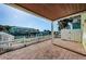 Covered patio features brick flooring, waterfront views, and stairs to upper floors at 5196 Beach Se Dr # B, St Petersburg, FL 33705