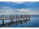 Scenic view of a wooden pier extending into calm waters, perfect for relaxation at 5196 Beach Se Dr # B, St Petersburg, FL 33705