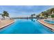 Expansive community pool with ample seating and stunning ocean views for a resort-style experience at 5196 Beach Se Dr # B, St Petersburg, FL 33705