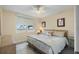 Cozy bedroom with view of palm trees, comfortable bedding and neutral decor at 6001 Bahia Del Mar Cir # 429, St Petersburg, FL 33715