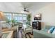 Bright living room with water view, comfortable seating, and stylish decor at 6001 Bahia Del Mar Cir # 429, St Petersburg, FL 33715