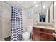 Bathroom features a shower and vanity with granite countertop at 6800 20Th N Ave # 309, St Petersburg, FL 33710