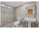 Bathroom featuring a glass-enclosed shower, tile accents, and pedestal sink at 6800 20Th N Ave # 309, St Petersburg, FL 33710