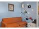 Cozy living room with a decorative wall and modern orange sofa at 6800 20Th N Ave # 309, St Petersburg, FL 33710