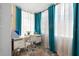 Bright office space with large windows, desk area, and vibrant curtains at 6800 20Th N Ave # 309, St Petersburg, FL 33710