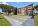 Outdoor shuffleboard court with benches and surrounding green space near the building at 6800 20Th N Ave # 309, St Petersburg, FL 33710