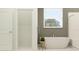 Luxurious bathroom featuring a standalone tub with modern finishes and ample natural light at 6834 E 115Th St, Palmetto, FL 34221